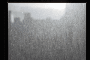 Window covered in dust and water marks.
