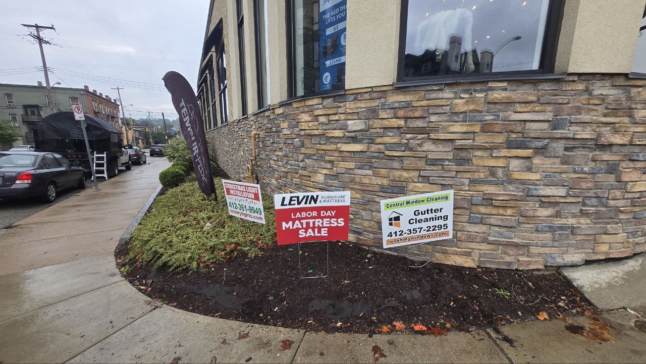 Central Window Cleaning gutter cleaning yard sign outside a Pittsburgh PA area business